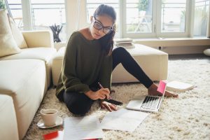 Woman studying in her living room